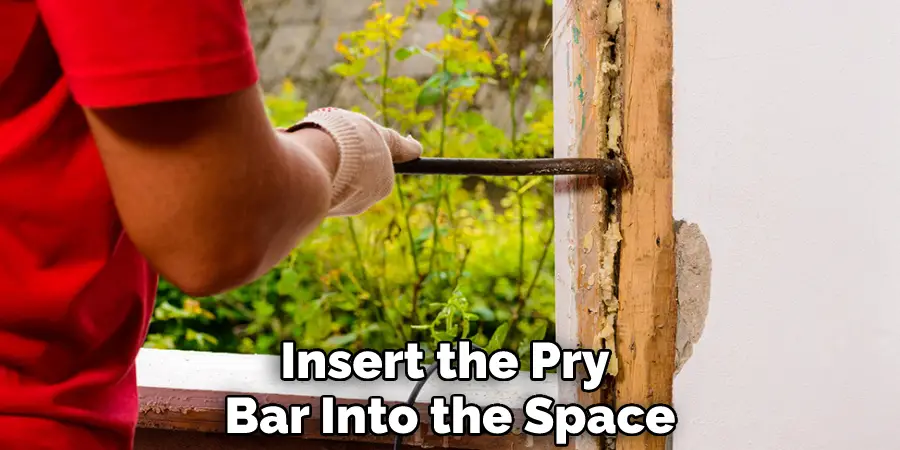 Insert the Pry Bar Into the Space
