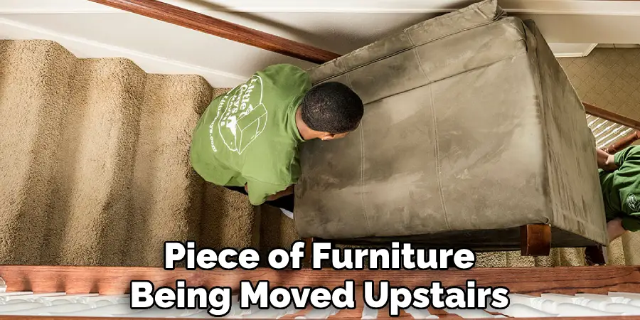 Piece of Furniture Being Moved Upstairs