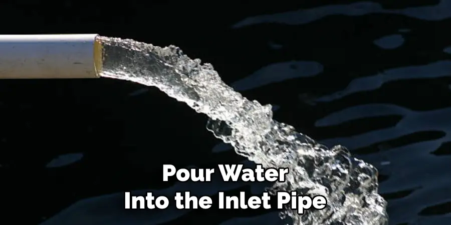 Pour Water Into the Inlet Pipe