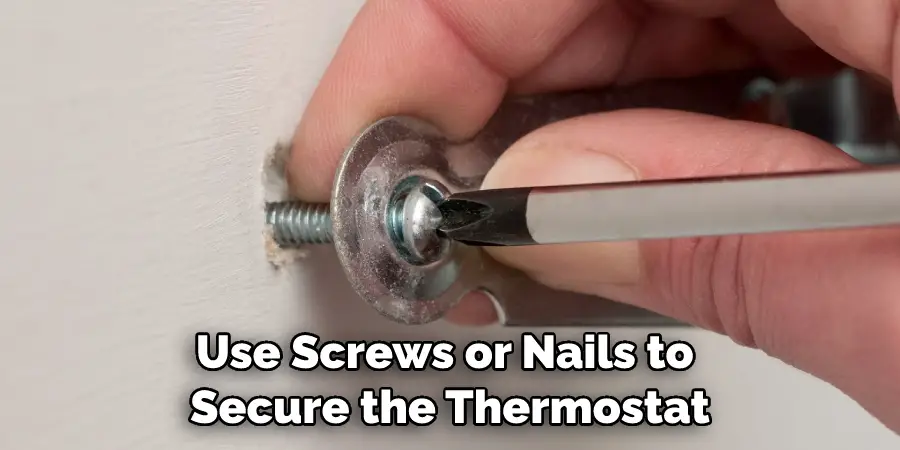 Use Screws or Nails to Secure the Thermostat