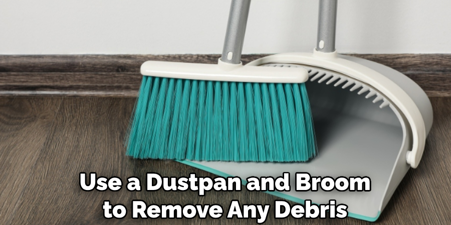 Use a Dustpan and Broom to Remove Any Debris