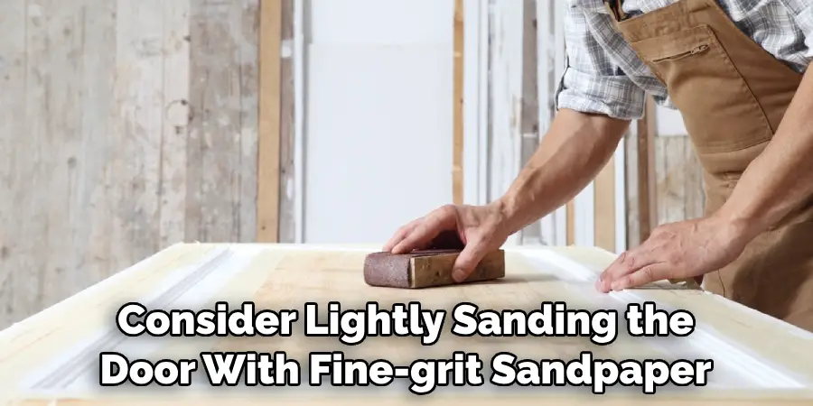 Consider Lightly Sanding the Door With Fine-grit Sandpaper