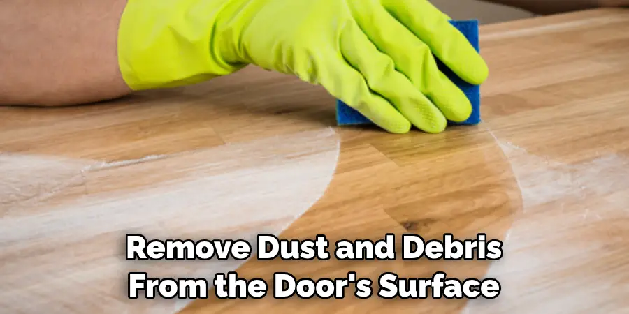 Remove Dust and Debris From the Door's Surface