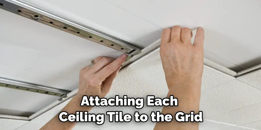 Attaching Each Ceiling Tile to the Grid