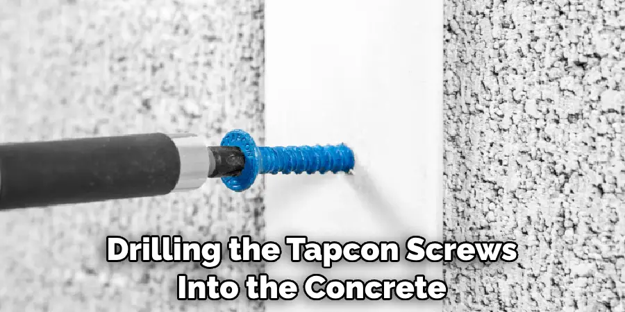 Drilling the Tapcon Screws Into the Concrete
